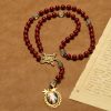 Handmade Rosary with Cinnabar Beads and Jesus Medal – A Divine Emblem of Faith's Devotion