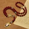 Handmade Rosary with Cinnabar Beads and Jesus Medal – A Divine Emblem of Faith's Devotion