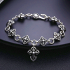 Retro - Styled Sterling Silver Cross Bracelet with Floral Motifs: A Nostalgic Sign of Faith