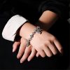 Retro - Styled Sterling Silver Cross Bracelet with Floral Motifs: A Nostalgic Sign of Faith