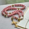 Mary's Light Pink Ceramic Rosary: Celebrate Christmas with Grace and Hope