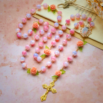 Virgin Mary with Rose-Accented Rosary: Timeless Faith & Floral Faith Symbol